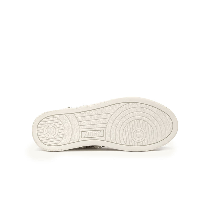 sneakers autry medalist femmes à fleurs blanches en relief vues de la semelle