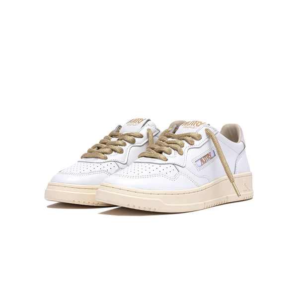 sneakers autry medalist blanches et dorées femmes vue de trois quarts