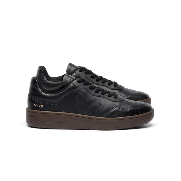Side view of sustainable VEJA V-90 O.T. Leather sneakers in full black and eagle for men and women