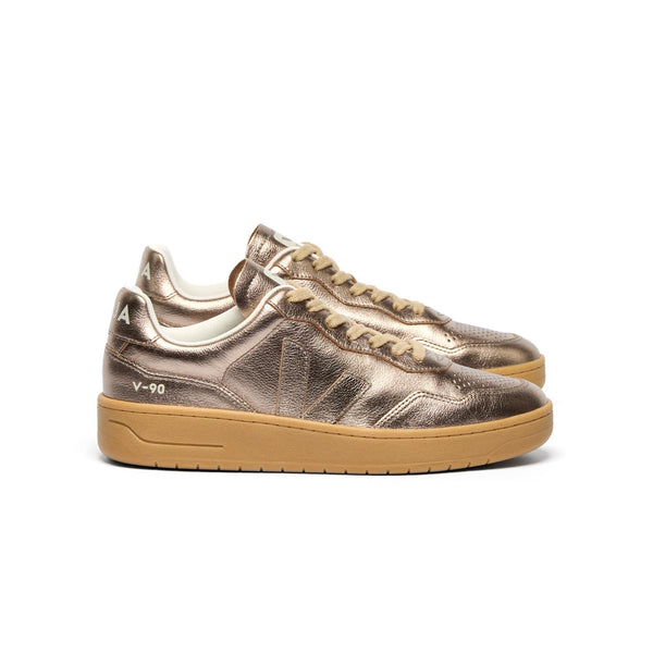 Side view of sustainable VEJA V-90 O.T. Leather women’s sneakers in shiny full bronze and natural