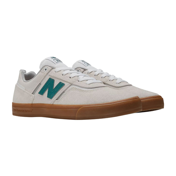 Chaussure de skate New Balance Numeric 306 Beige logo vert canard semelle gum vue de coté 